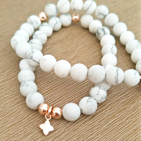 Howlite & Rose Gold beaded bracelet with flower/cross charm